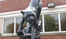 A bronze statue of a wild cat